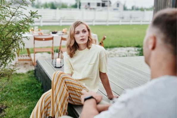The couple discusses jealousy calmly, fostering open communication in the relationship