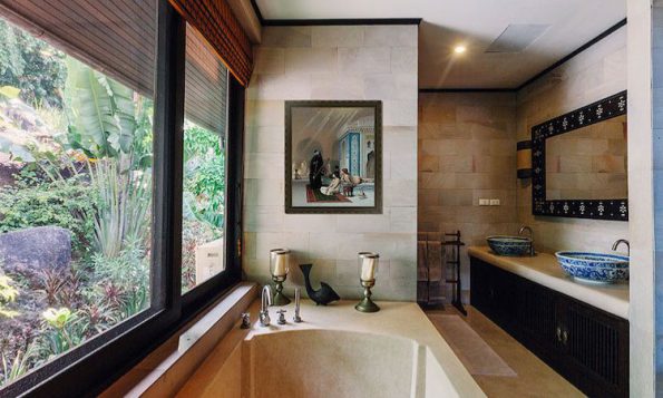 framed artwork, a statement mirror, and cozy bath rug for a unique style.